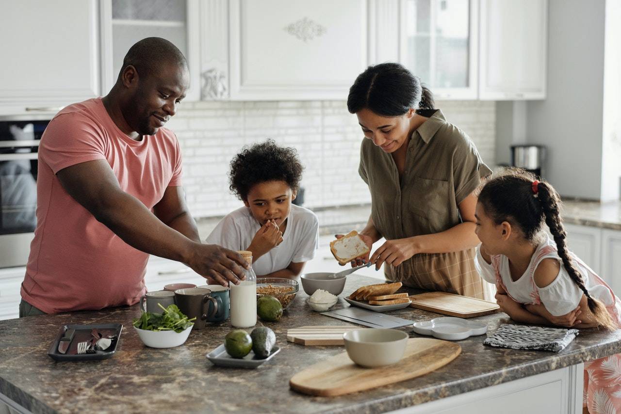 a family making meals in the kitchen